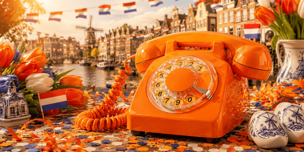 Oranje EventTelefoon met Nederlandse vlaggetjes, tulpen, Delfts blauw en Amsterdamse grachten als Hollandse beleving voor een Around the World feest.